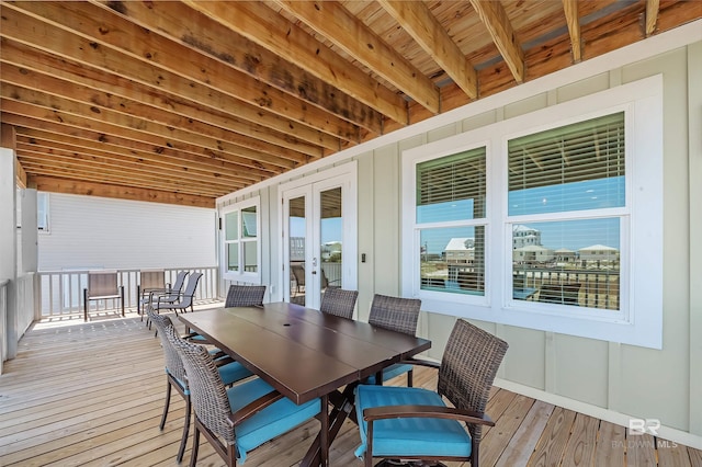 1337 W Lagoon Ave, Gulf Shores, AL 36542 - wooden terrace with french doors and outdoor dining area