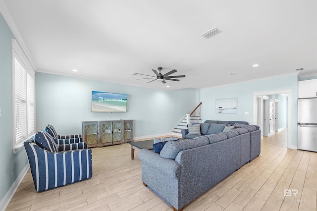 1337 W Lagoon Ave, Gulf Shores, AL 36542 - living room with stairs, ornamental molding, light wood finished floors, ceiling fan, and visible vents
