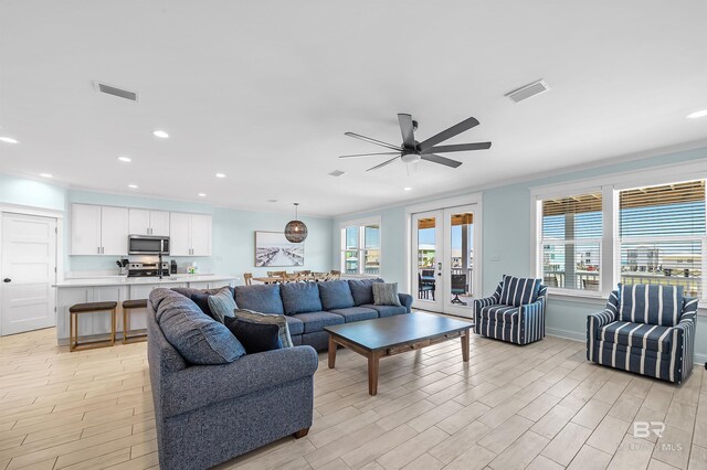 1337 W Lagoon Ave, Gulf Shores, AL 36542 - living room featuring plenty of natural light, ceiling fan, and visible vents