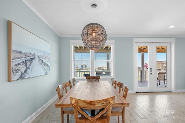 1337 W Lagoon Ave, Gulf Shores, AL 36542 - dining room featuring french doors, baseboards, light wood-style floors, and a chandelier