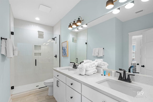 1337 W Lagoon Ave, Gulf Shores, AL 36542 - bathroom with visible vents, a sink, toilet, and a stall shower