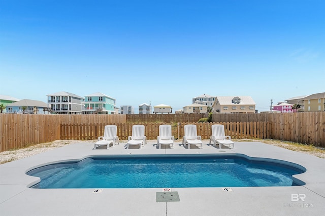 1337 W Lagoon Ave, Gulf Shores, AL 36542 - view of swimming pool featuring a fenced backyard, a residential view, a patio area, and a fenced in pool