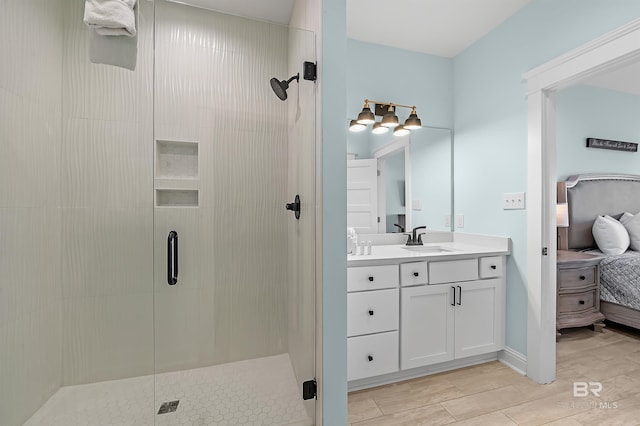 1337 W Lagoon Ave, Gulf Shores, AL 36542 - ensuite bathroom featuring wood tiled floor, vanity, ensuite bath, and a shower stall