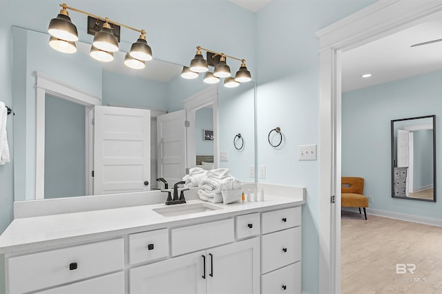 1337 W Lagoon Ave, Gulf Shores, AL 36542 - full bath featuring ensuite bathroom, baseboards, wood finished floors, and vanity