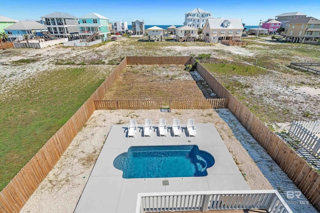 1337 W Lagoon Ave, Gulf Shores, AL 36542 - view of pool with a patio, a fenced backyard, and a residential view