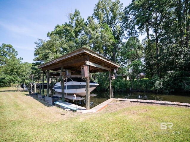 dock area featuring a water view and a lawn