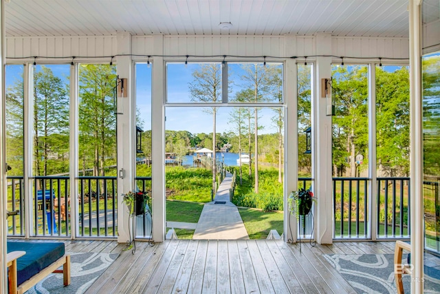 unfurnished sunroom featuring wood ceiling