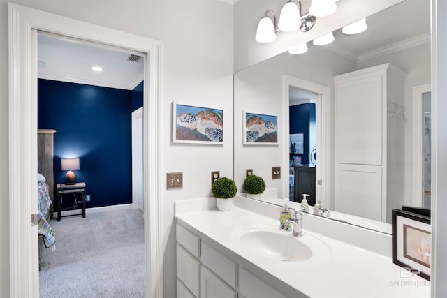 bathroom with vanity and crown molding