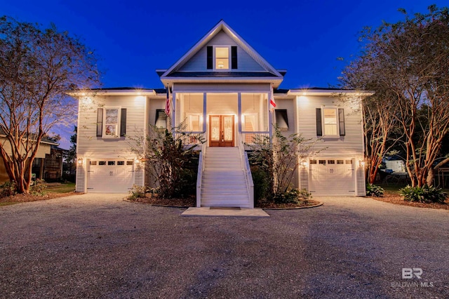 view of front of property featuring a garage and french doors