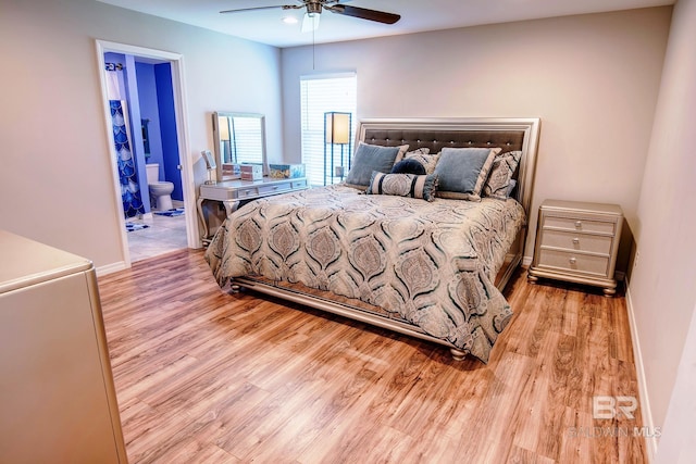 bedroom featuring baseboards, ceiling fan, wood finished floors, and connected bathroom