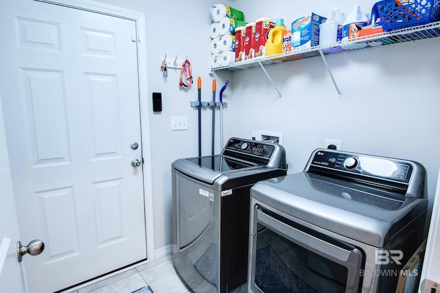 laundry room featuring independent washer and dryer, laundry area, and light tile patterned floors