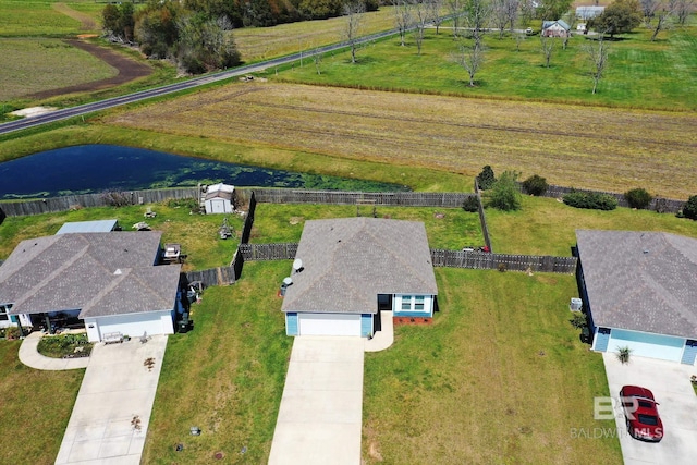 drone / aerial view with a water view and a rural view