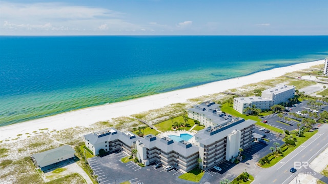 drone / aerial view featuring a view of the beach and a water view