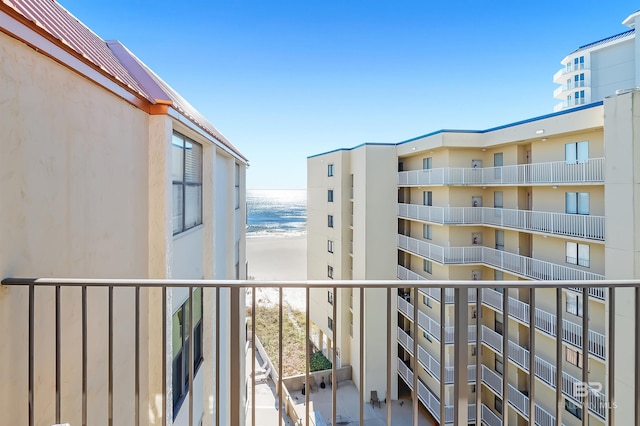 balcony with a view of the beach and a water view