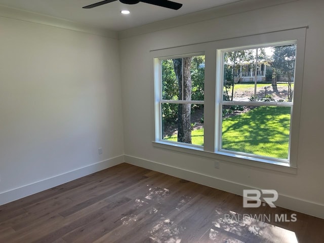 unfurnished room featuring ceiling fan, hardwood / wood-style flooring, and ornamental molding