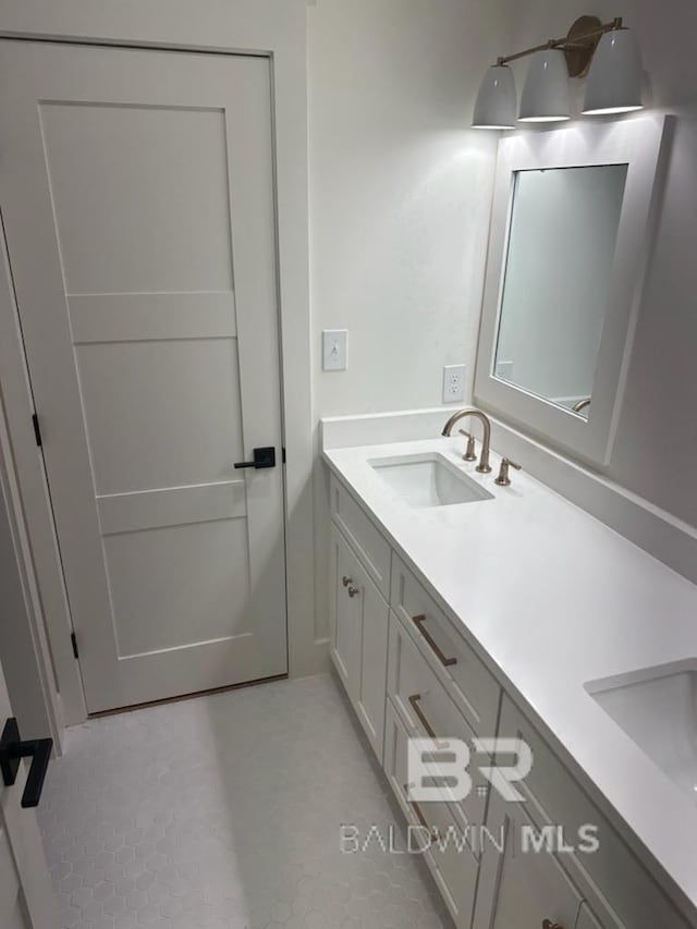 bathroom with vanity and tile patterned flooring