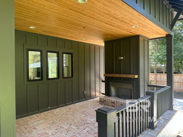 view of patio featuring an outdoor brick fireplace