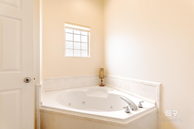 bathroom featuring a relaxing tiled tub