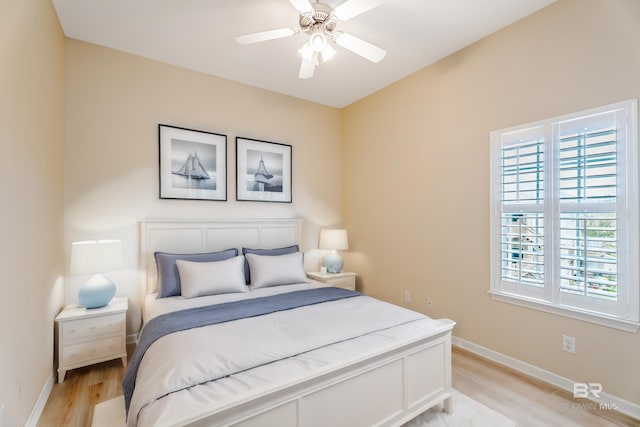 bedroom featuring ceiling fan and light hardwood / wood-style floors