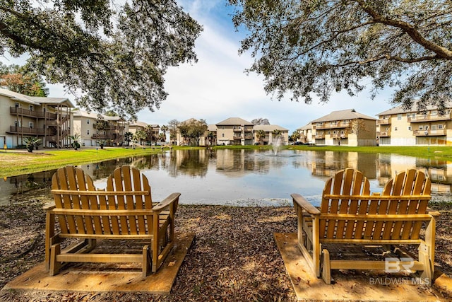 view of home's community with a water view