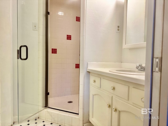 bathroom with vanity and a shower stall