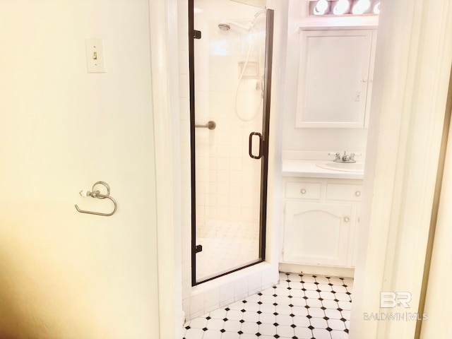 bathroom featuring vanity and a shower stall