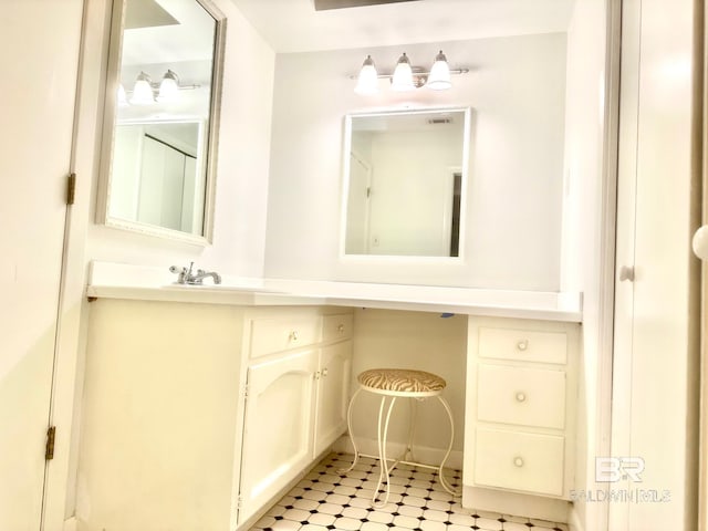 bathroom featuring tile patterned floors, visible vents, and vanity