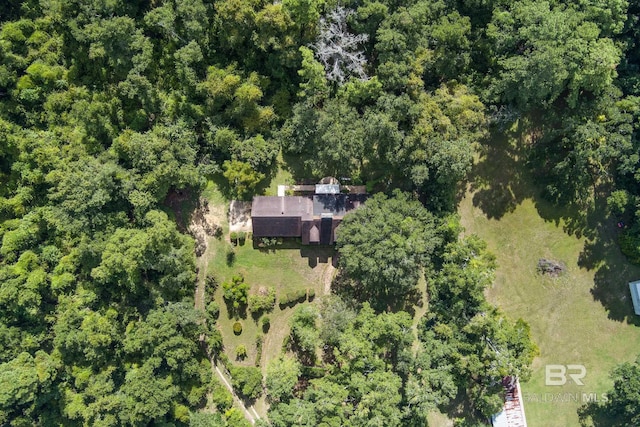 birds eye view of property with a wooded view