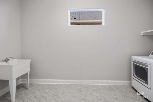 laundry area with sink and washer / dryer