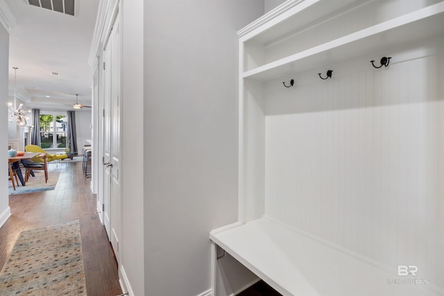 mudroom featuring ceiling fan with notable chandelier and dark hardwood / wood-style flooring