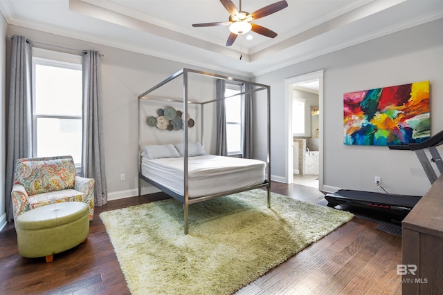 bedroom featuring ceiling fan, dark hardwood / wood-style flooring, and multiple windows