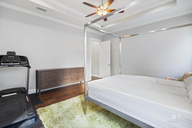 bedroom featuring crown molding, ceiling fan, a tray ceiling, and dark hardwood / wood-style flooring