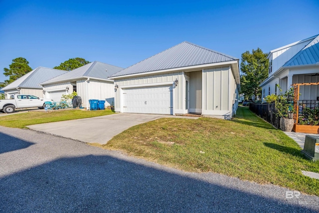 view of front facade featuring a front yard and a garage