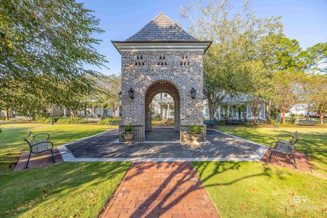 entrance to property featuring a lawn