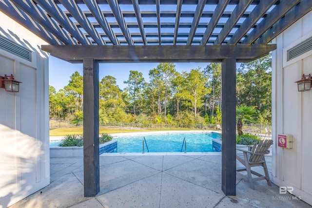 view of pool with a patio area and a pergola