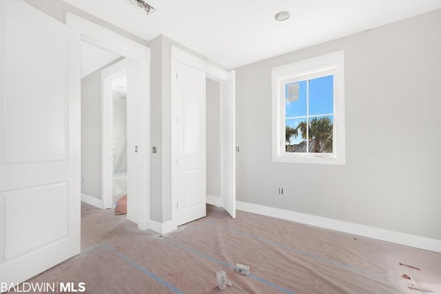 unfurnished bedroom featuring a closet