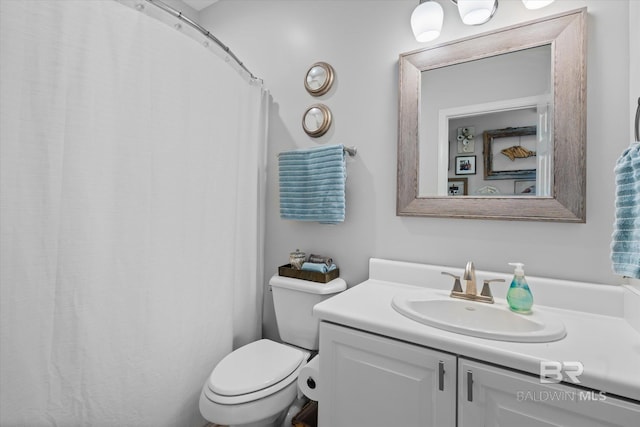 bathroom with vanity and toilet