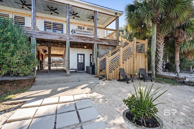 rear view of house with a patio area and ceiling fan