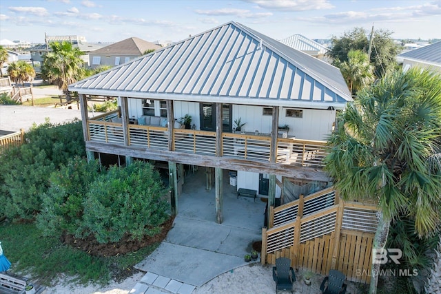 exterior space featuring a wooden deck and a carport