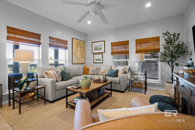 tiled living room with ceiling fan