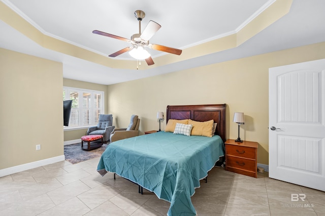 tiled bedroom featuring crown molding, ceiling fan, and a tray ceiling