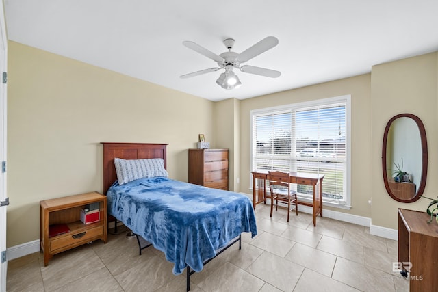 tiled bedroom with ceiling fan