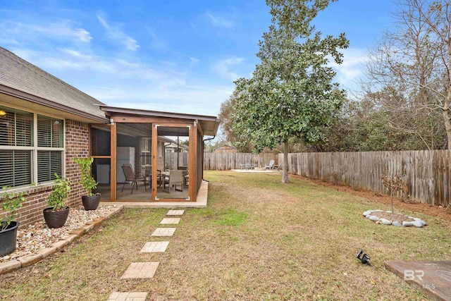 view of yard featuring a sunroom