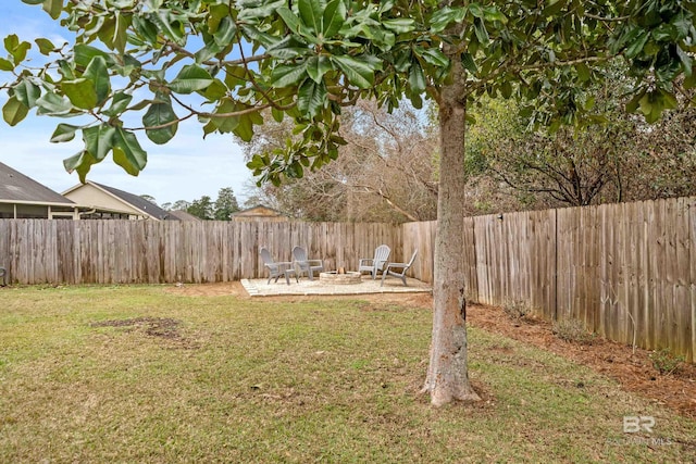 view of yard featuring a patio and an outdoor fire pit