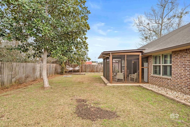 view of yard with a sunroom