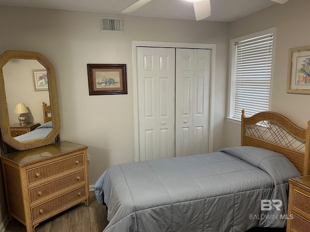 633 W Beach Blvd Unit 303, Gulf Shores, AL 36542 - bedroom with wood finished floors and a closet