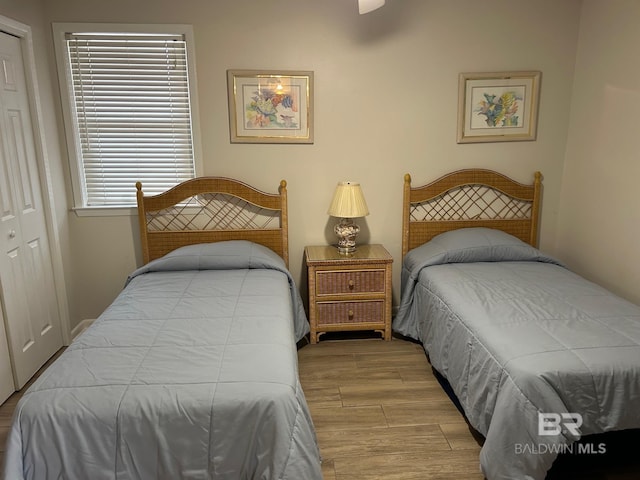 633 W Beach Blvd Unit 303, Gulf Shores, AL 36542 - bedroom with wood finished floors and a closet