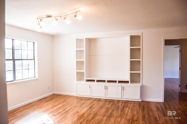 unfurnished living room featuring hardwood / wood-style floors