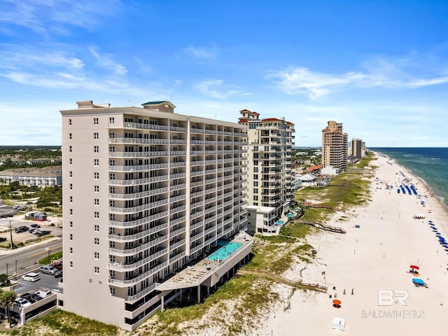 view of property featuring a view of the beach and a water view