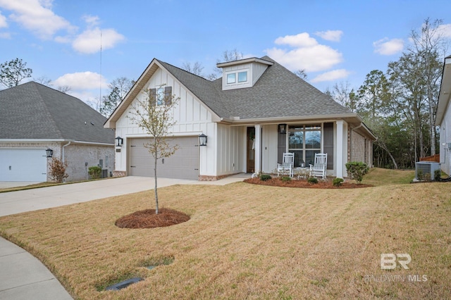 view of front of house with a porch, concrete driveway, board and batten siding, a front yard, and a garage